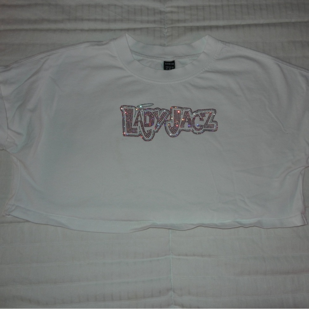 Top Gun Lady jags bedazzled cropped white shirt.